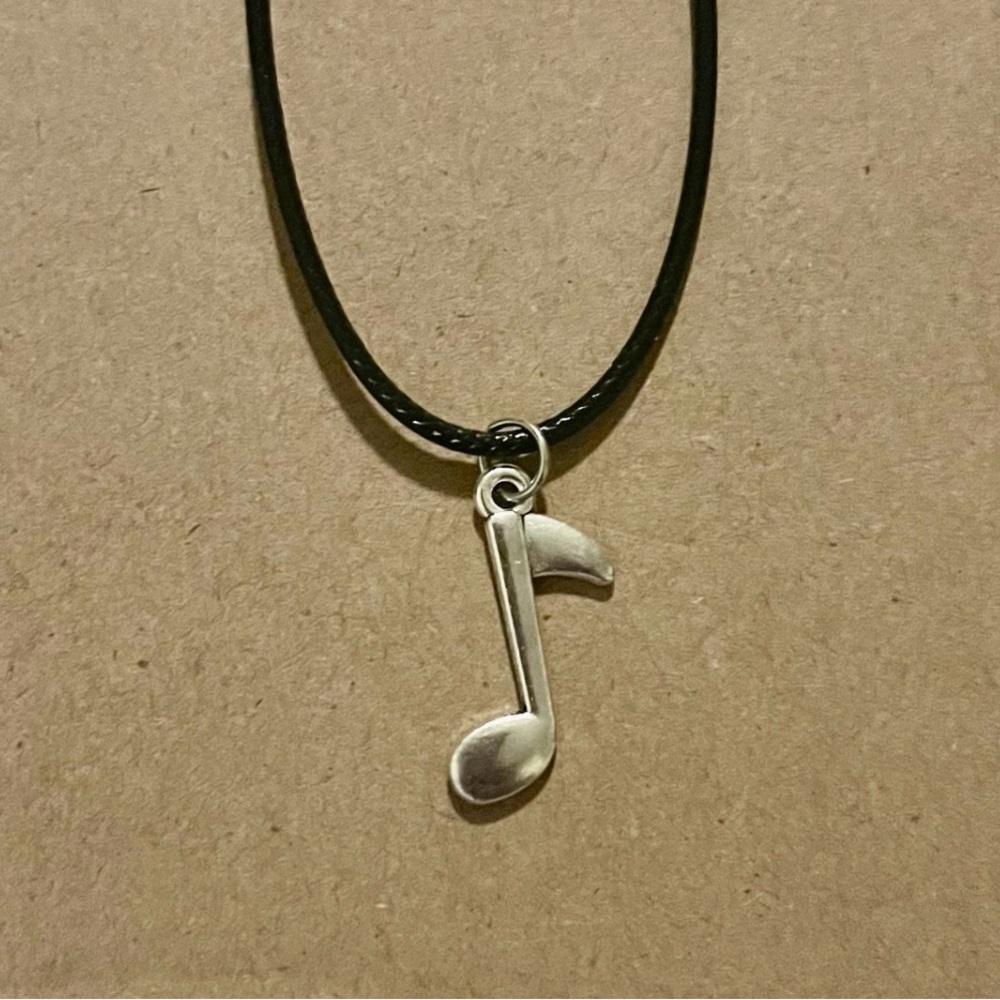 Silver Music Note Pendant Necklace on Black Cord